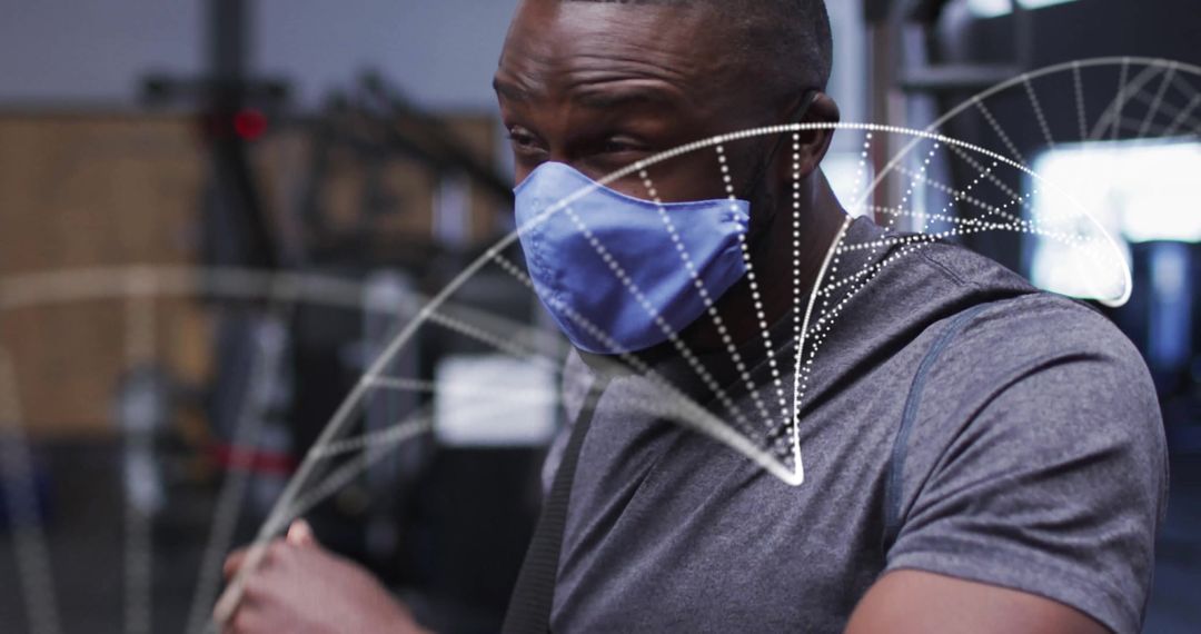 Man Training in Gym Wearing Mask with Futuristic Overlay