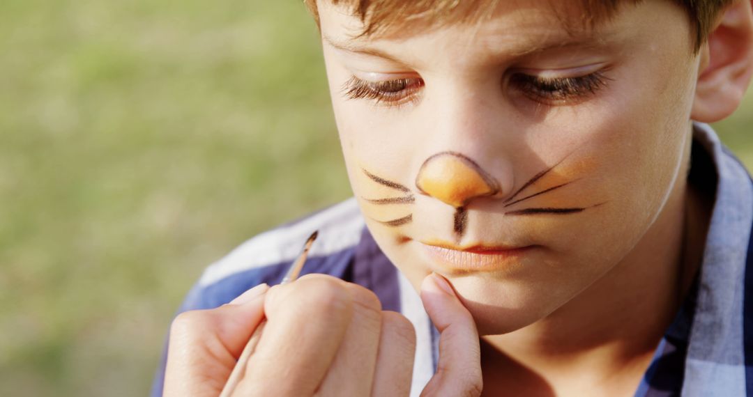 Child Getting Face Painted as a Cat with Whiskers - Free Images, Stock Photos and Pictures on Pikwizard.com