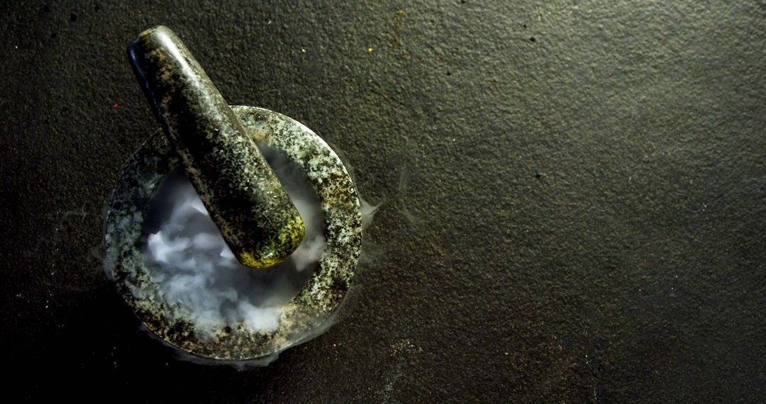 Mortar and pestle with spices and smoky effect - Free Images, Stock Photos and Pictures on Pikwizard.com