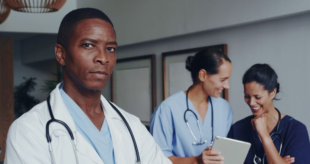 Confident African American Doctor with Medical Staff in Hospital - Free Images, Stock Photos and Pictures on Pikwizard.com