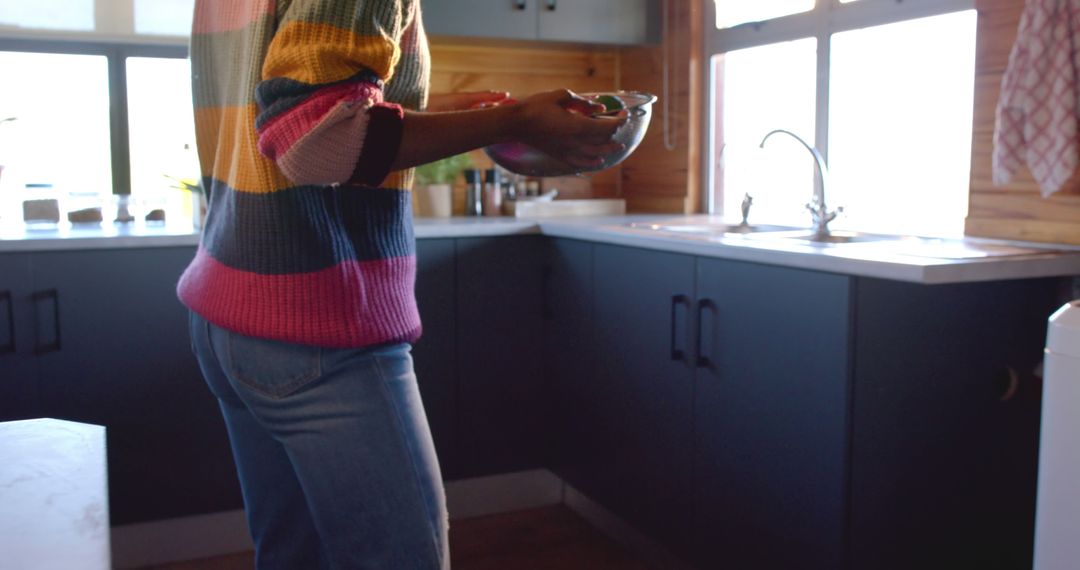 Person Preparing Meal in Cozy Modern Kitchen - Free Images, Stock Photos and Pictures on Pikwizard.com