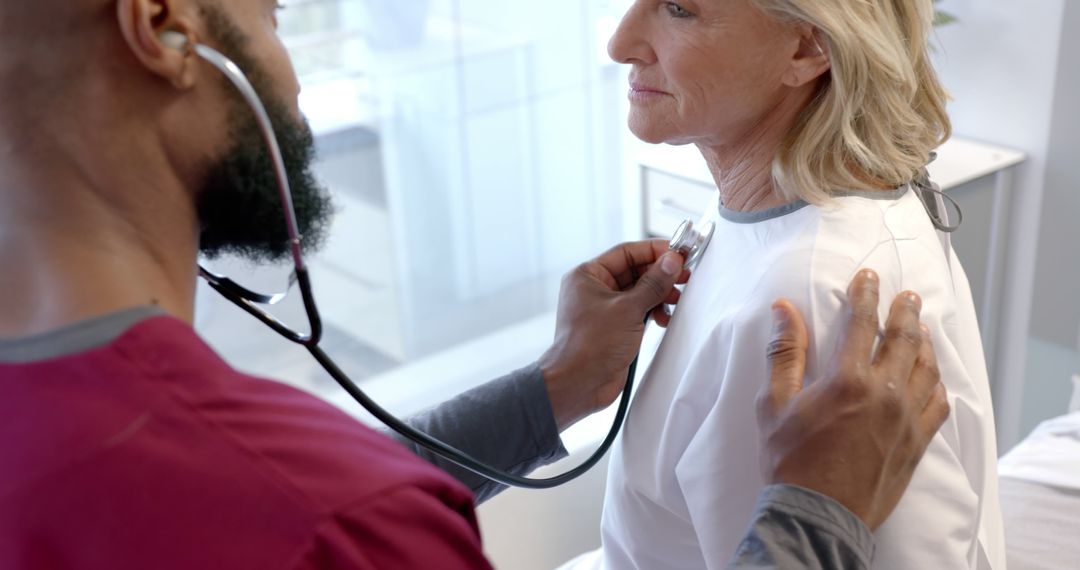 Healthcare Professional Examining Elderly Patient with Stethoscope - Free Images, Stock Photos and Pictures on Pikwizard.com