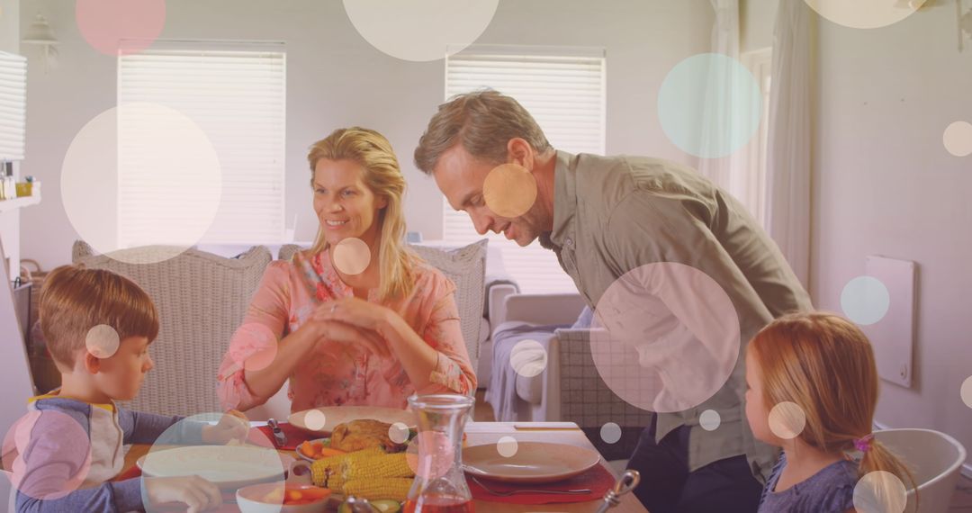 Caucasian Family Joyfully Sharing Meal with Overlay of Falling Spots