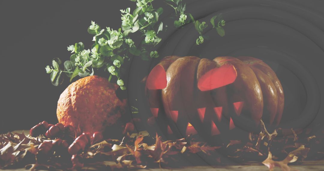 Spooky Halloween Pumpkin with Leaves and Greenery