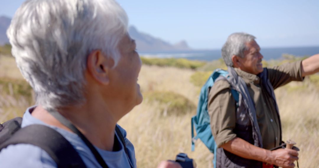 Seniors Enjoying Nature Hike in Scenic Landscapes - Free Images, Stock Photos and Pictures on Pikwizard.com