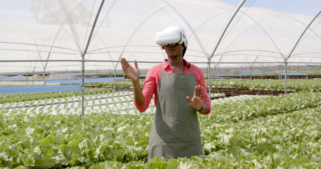 Farmer Using VR Headset in Hydroponic Farm Operations