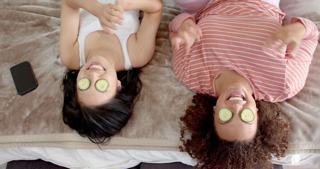 Friends Relaxing at Home with Cucumber Eye Spa Masks
