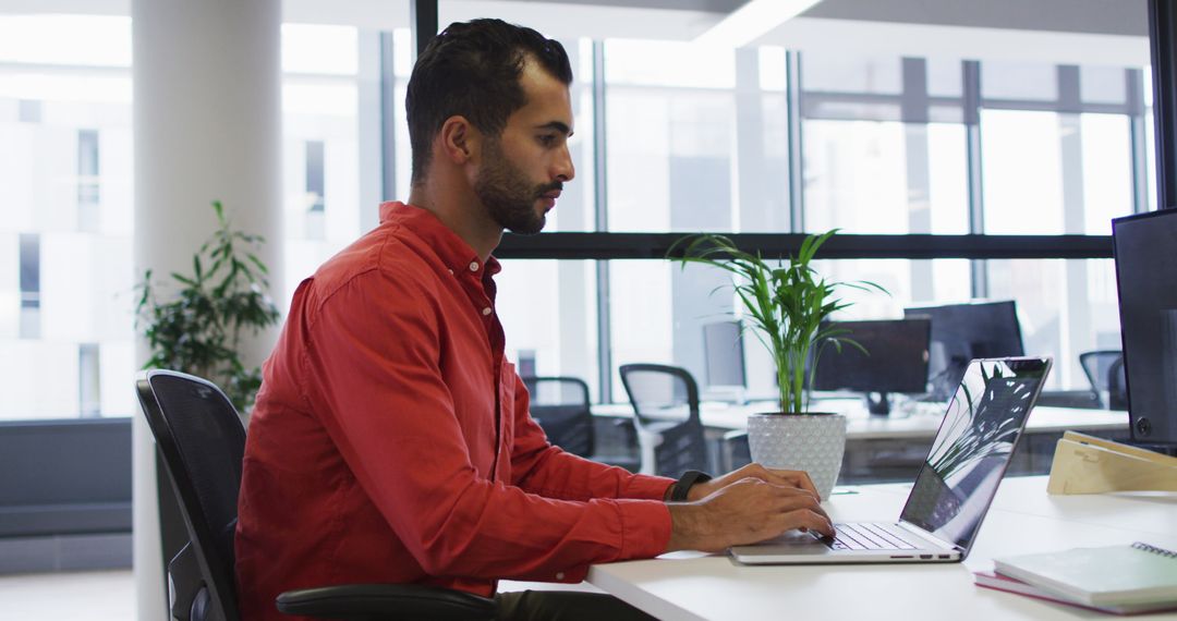 Focused businessperson working at modern office desk