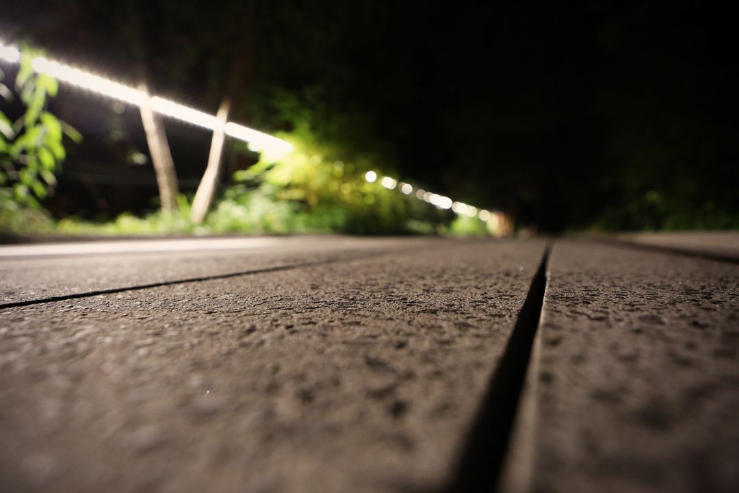 Close-up of Wooden Boardwalk at Night with String Lights - Free Images, Stock Photos and Pictures on Pikwizard.com