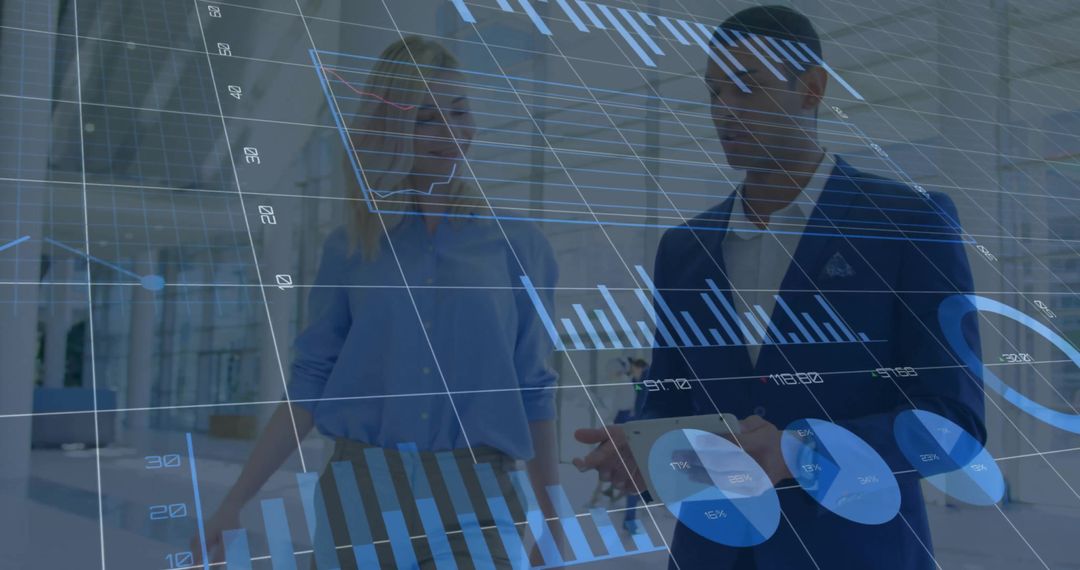 Diverse Professionals Analyzing Financial Graphics in Modern Office