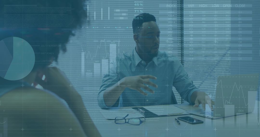 Business presenter gesturing during financial analytics review with laptop and chart overlays