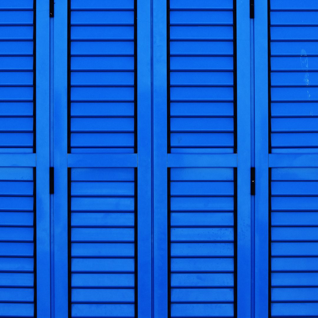 Bright Blue Wooden Shutters with Geometric Pattern - Free Images, Stock Photos and Pictures on Pikwizard.com