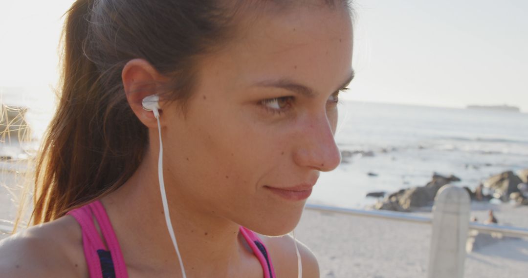 Determined Woman Enjoys Beach Run at Sunset