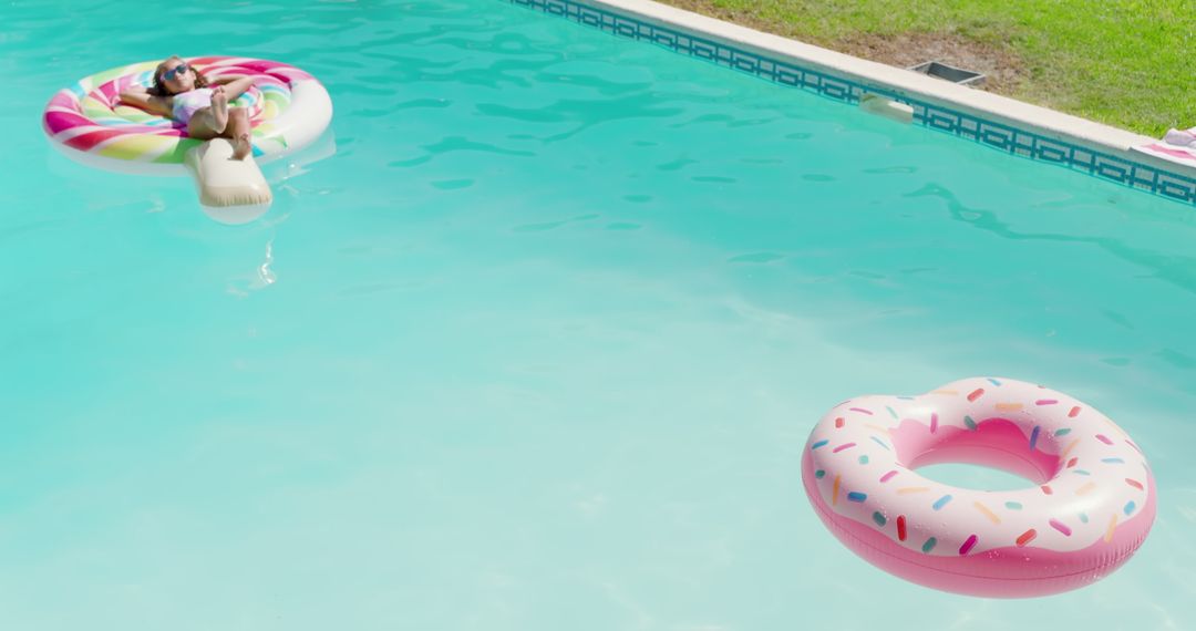 Child Relaxing on Vibrant Pool Float in Refreshing Outdoors