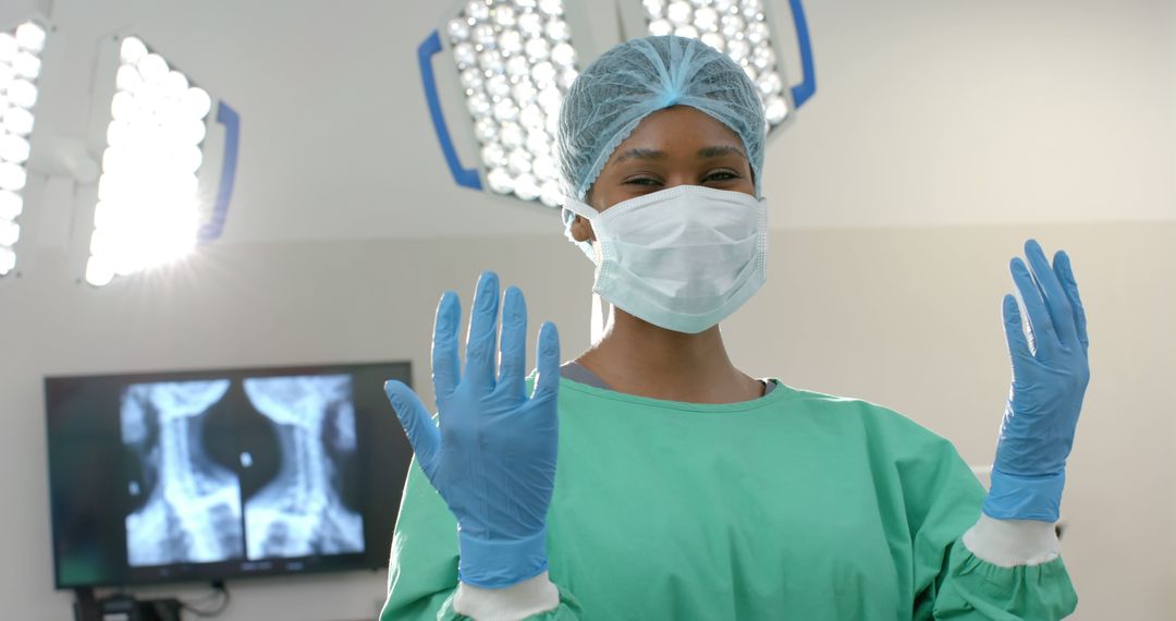 Smiling Female Surgeon in Scrubs and Gloves in Operating Room - Free Images, Stock Photos and Pictures on Pikwizard.com