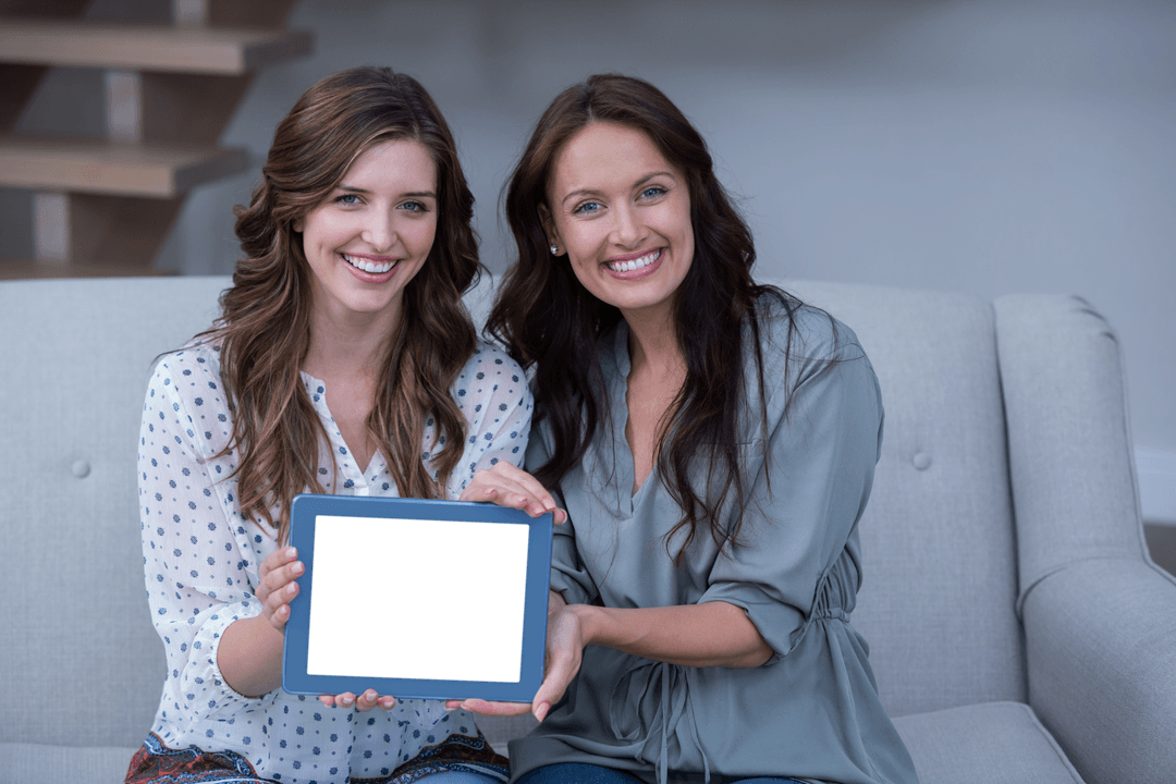 Smiling Women Holding Transparent Digital Tablet at Home