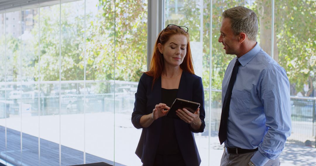 Professional Team Collaborating on Digital Project in Modern Office