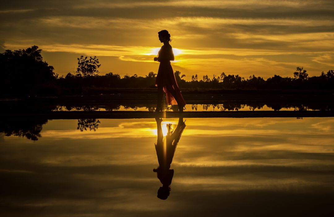 Silhouette Woman at Sunset - Free Images, Stock Photos and Pictures on Pikwizard.com