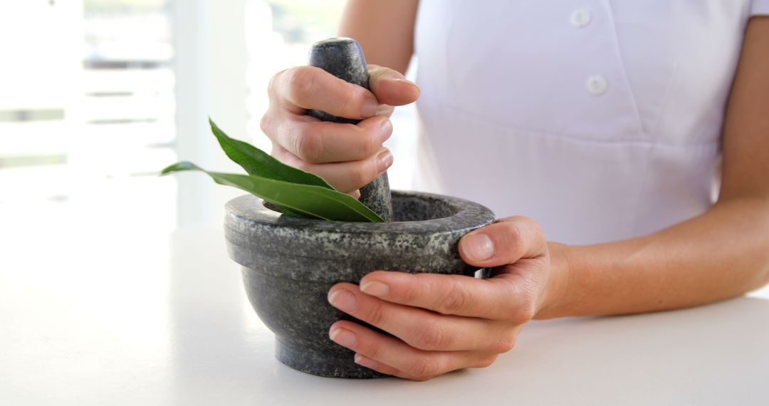 Herbal Medicine Preparation Using Mortar and Pestle - Free Images, Stock Photos and Pictures on Pikwizard.com