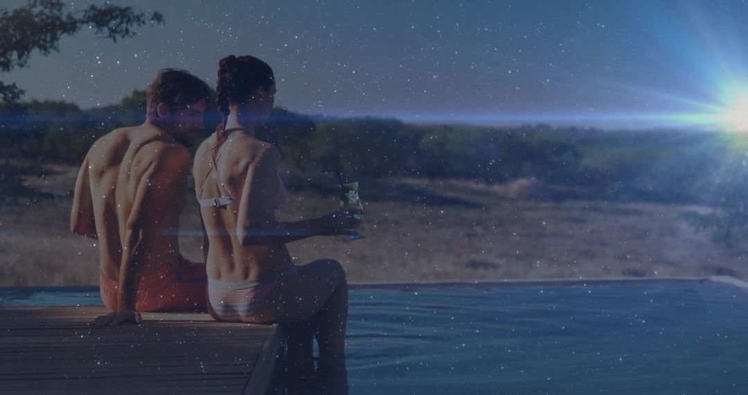 Romantic Couple Relaxing at Scenic Poolside with Sparkling Night Sky