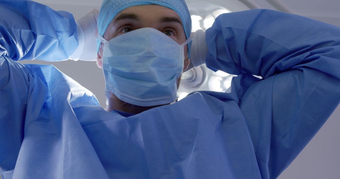 Surgeon Prepares for Surgery in Operating Room - Free Images, Stock Photos and Pictures on Pikwizard.com