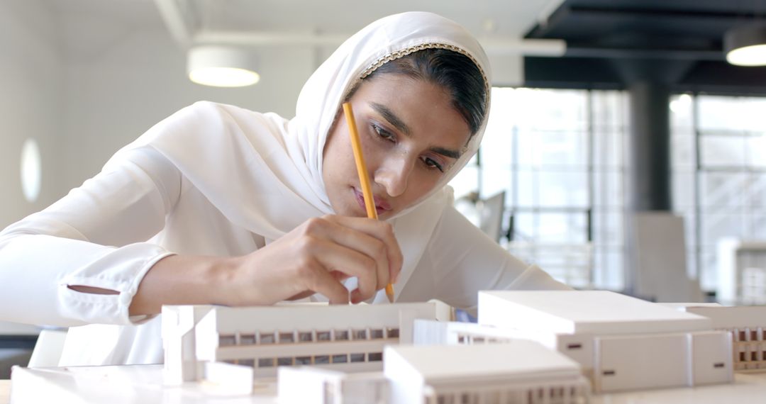 Female Architect Designing Model with Precision and Focus