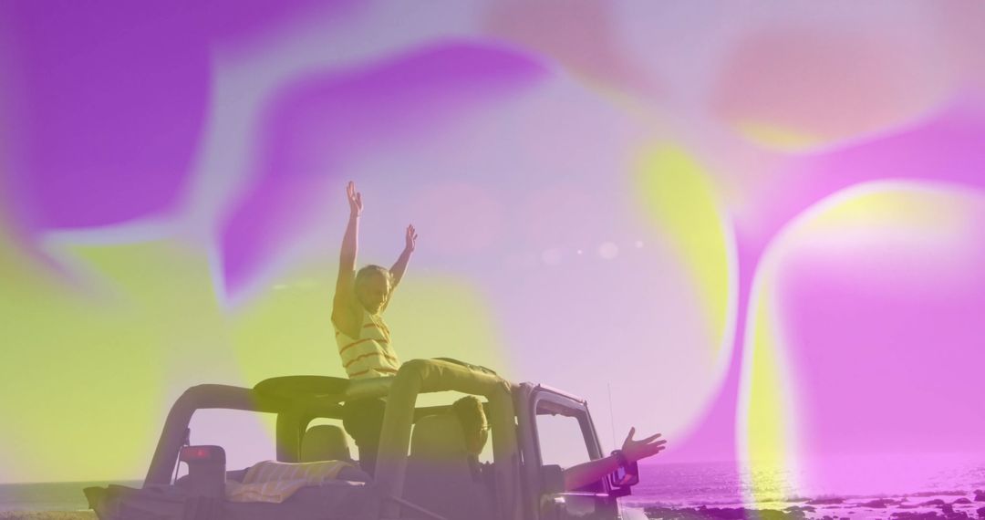 Joyful Jeep Adventure Near Rocky Shoreline with Bokeh Effects