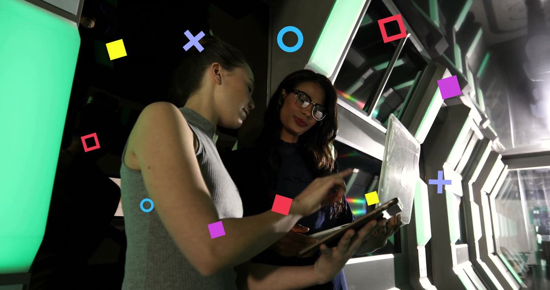 Colleagues Examining AR Interface on Tablet with Futuristic Elements