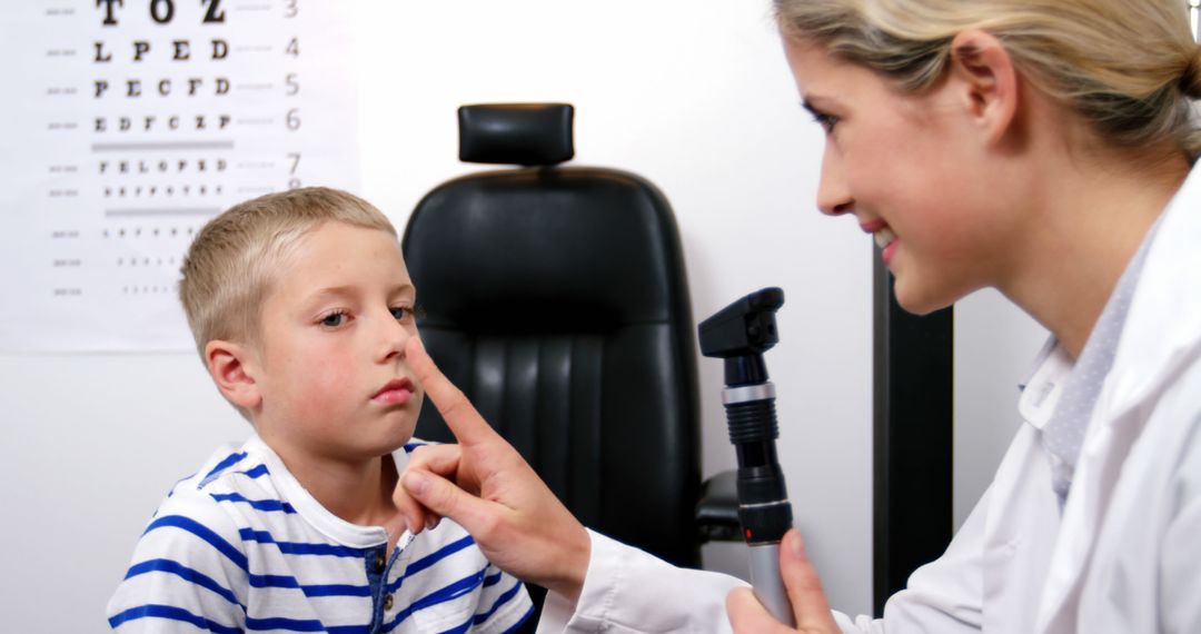 Optometrist Examining Child's Vision in Clinic - Free Images, Stock Photos and Pictures on Pikwizard.com