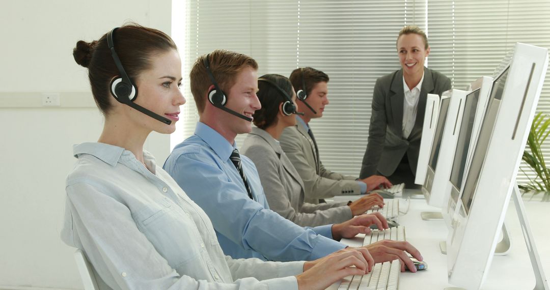 Focused Call Center Team Providing Customer Support - Free Images, Stock Photos and Pictures on Pikwizard.com