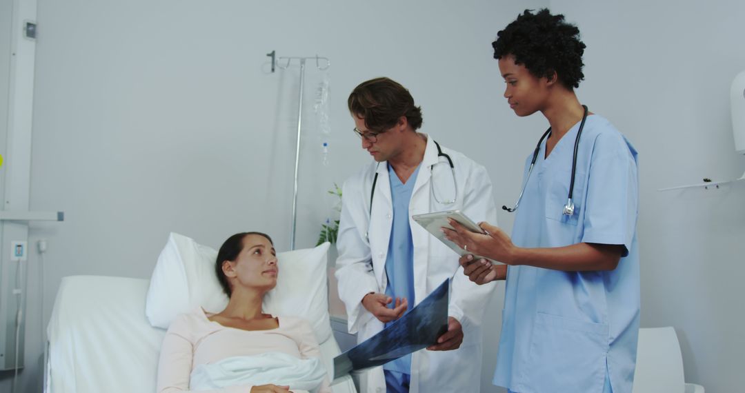 Doctor and Nurse Discussing X-Ray with Hospitalized Patient - Free Images, Stock Photos and Pictures on Pikwizard.com