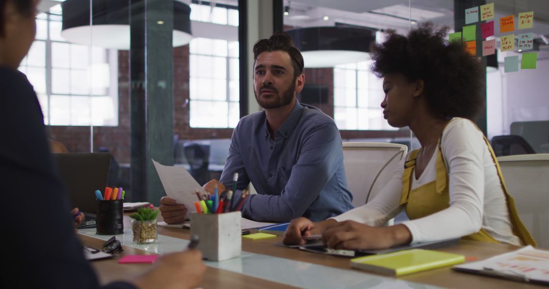 Multiracial Team Engaging in Collaborative Office Meeting