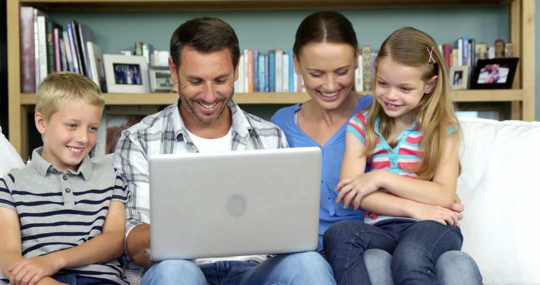 Happy Family Spending Quality Time Together on Laptop at Home - Free Images, Stock Photos and Pictures on Pikwizard.com