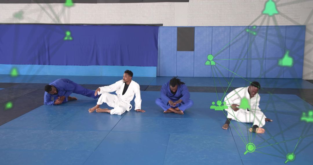 Martial artists stretching in gis on blue mats with green network icons and teamwork tech