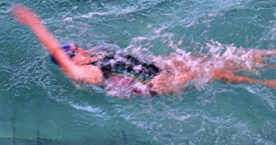 Competitive Swimmer Performing Backstroke in Swimming Pool - Free Images, Stock Photos and Pictures on Pikwizard.com