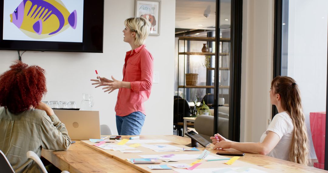 Diverse Team Collaborating in Modern Office on Visual Presentation