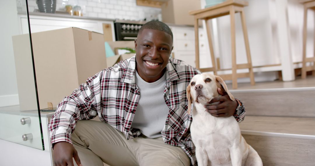 Happy Man with Pet Dog in New Home - Free Images, Stock Photos and Pictures on Pikwizard.com