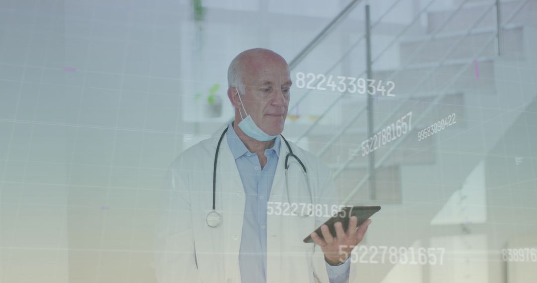 Senior Male Doctor Analyzing Data on Digital Tablet