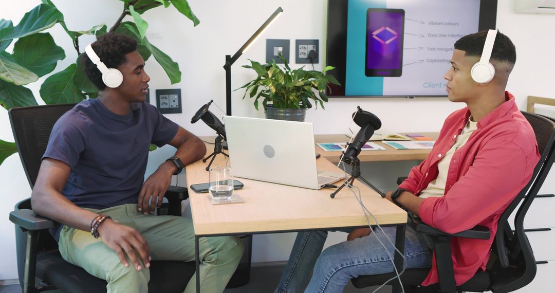 Diverse Male Coworkers Discussing in Modern Podcast Studio