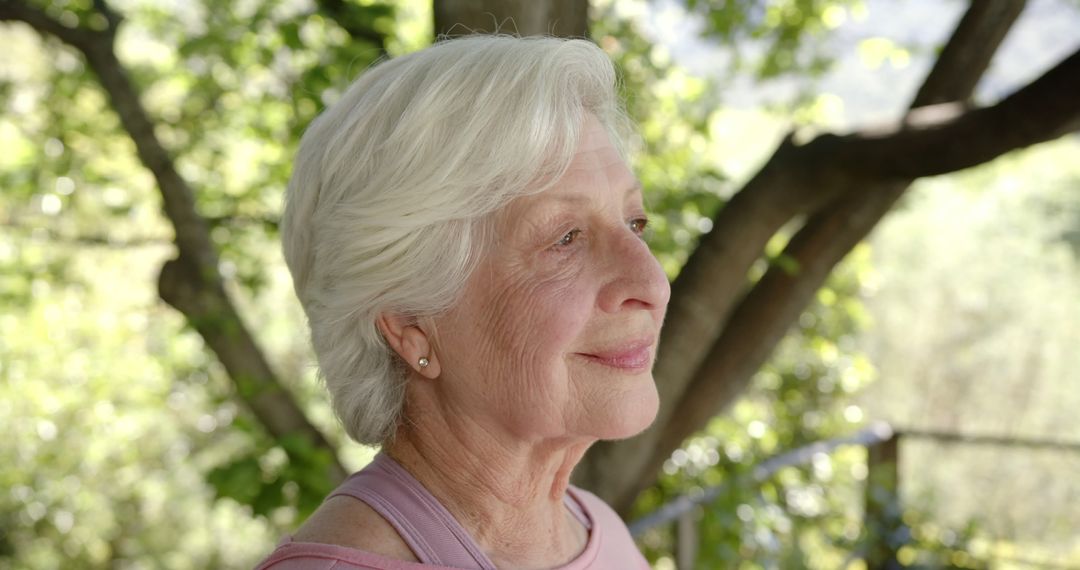 Contemplative Senior Woman Relaxing Outdoors - Free Images, Stock Photos and Pictures on Pikwizard.com