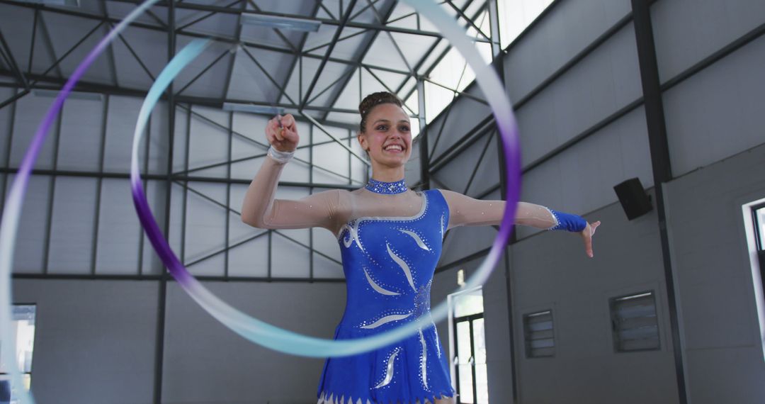 Young Gymnast Practicing Ribbon Routine in Gymnasium