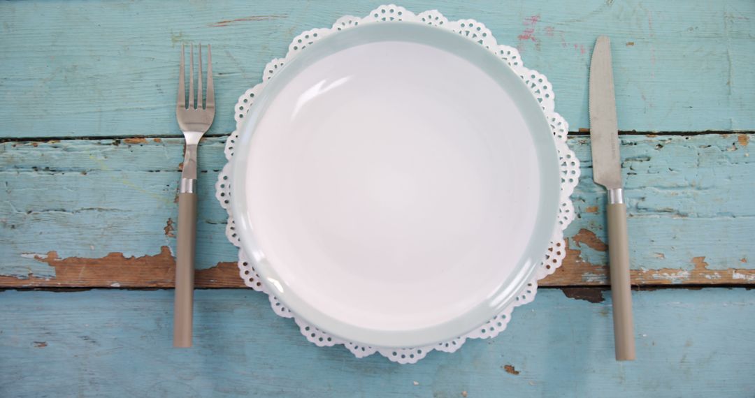 Empty Plate with Cutlery on Rustic Blue Wooden Table - Free Images, Stock Photos and Pictures on Pikwizard.com