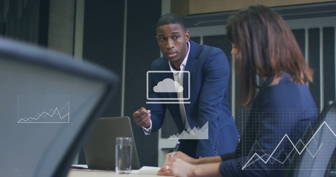 Busy Office with Businesspeople Analyzing Financial Data on Screen