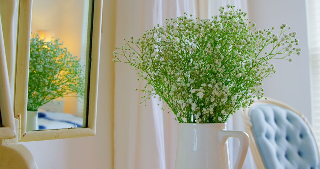 Reflective Surface with White Vase of Baby's Breath in Bright Home Interior - Free Images, Stock Photos and Pictures on Pikwizard.com