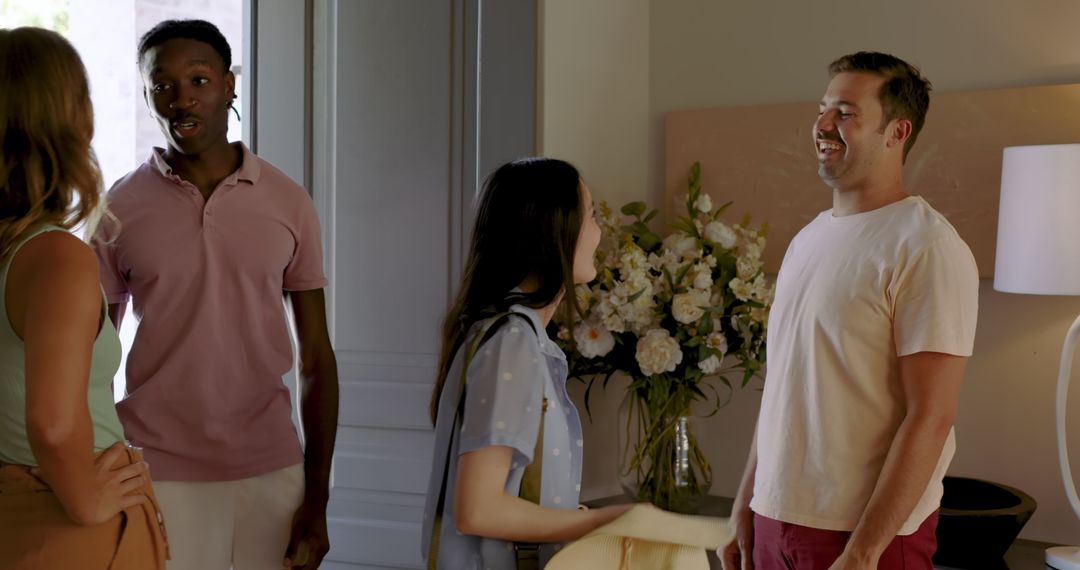 Diverse Friends Gathering in Home Entryway with Warm Welcomes