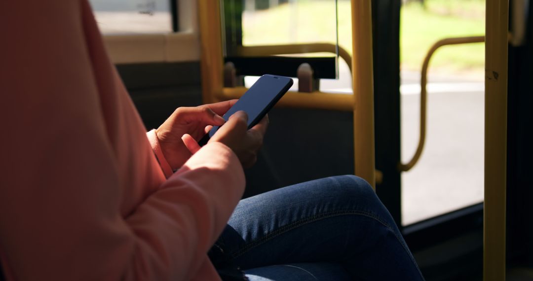 Person using smartphone on public bus - Free Images, Stock Photos and Pictures on Pikwizard.com