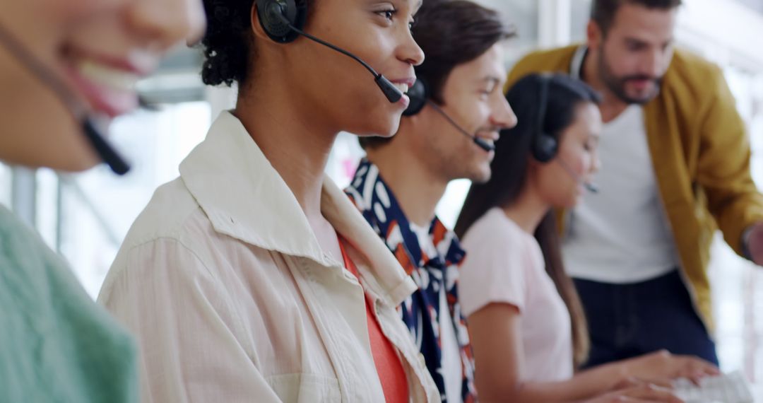 Diverse Customer Service Team Wearing Headsets in Office - Free Images, Stock Photos and Pictures on Pikwizard.com