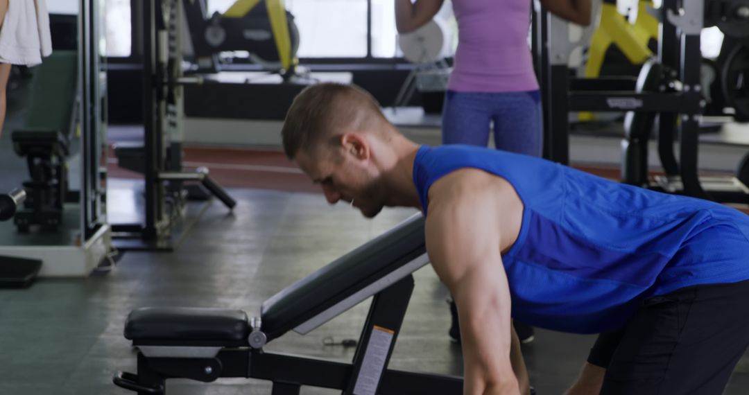 Man Completing Rowing Exercises in Modern Fitness Gym - Free Images, Stock Photos and Pictures on Pikwizard.com