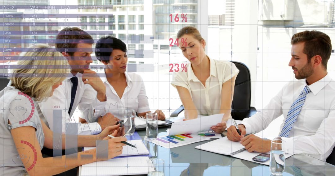 Diverse Business Team Analyzing Data Charts in Modern Office