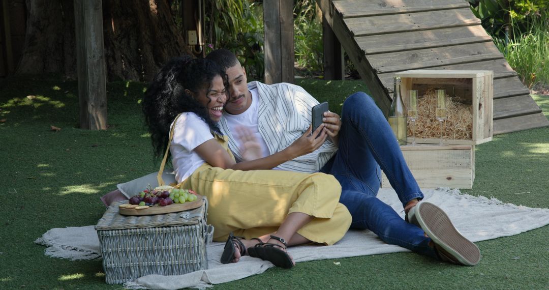 Happy Couple Enjoying Summer Picnic and Taking Selfie